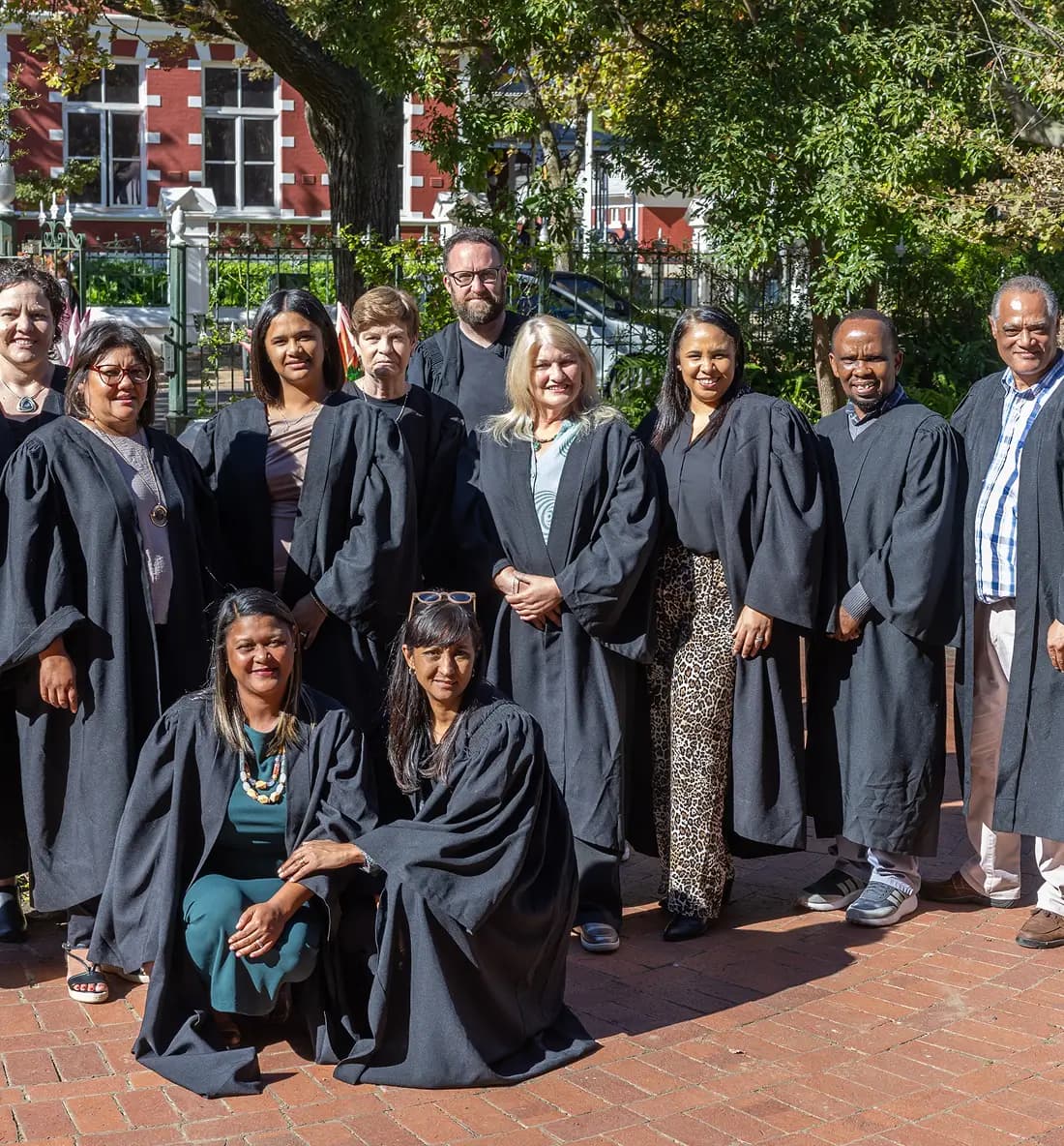Students standing at a graduation ceremony.